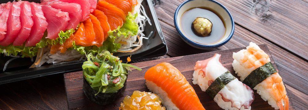 Wood table with various sushi selections